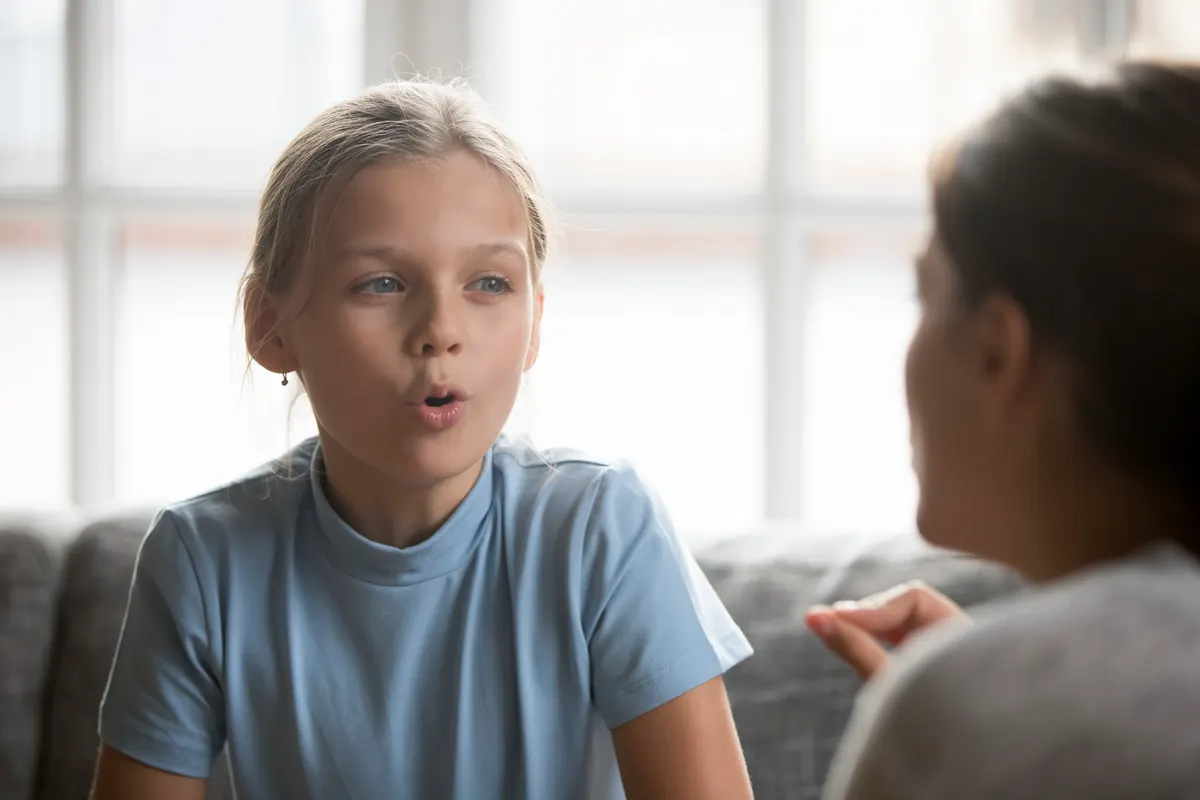 Young person talking with a supportive adult