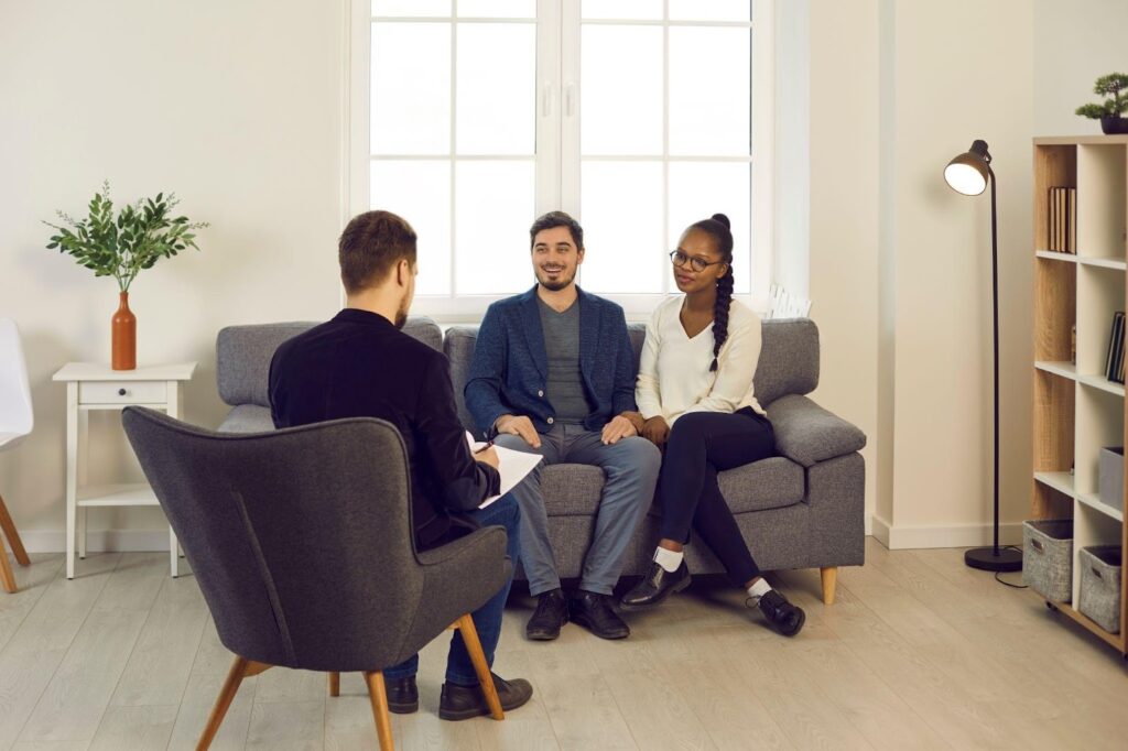 A couple sitting on a couch in a cozy living room